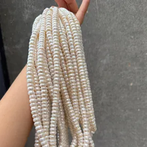 Detailed view of natural 8-9mm white rondelle pearls with high luster and texture