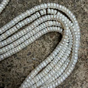 Close-up view of 7.5-8mm straight-cut white freshwater pearl DIY jewelry making beads strands.