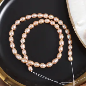 Detail view of natural freshwater pink rice pearls strand, perfect for DIY handmade jewelry.