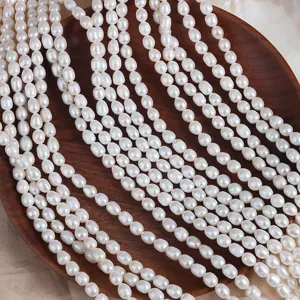 Detailed shot of natural freshwater rice pearls string, white baroque pearls for DIY jewelry.