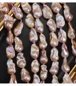 Close-up shot of large baroque freshwater pearls showing unique fishtail shape and strong luster.