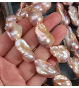 Natural freshwater baroque pearl strand, large irregular fish tail beads, strong luster.