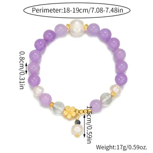 Elegantes Armband aus natürlicher Süßwasserperle und Kristallperlen mit Goldblüten-Anhänger.