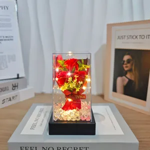 Artificial rose flower bouquet gift box with LED string lights and crystal stone base.