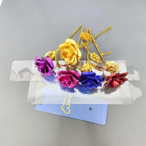Colorful gold foil rose detail shot, exquisite artificial flower gift with transparent box and card.