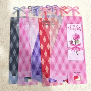 Transparent plaid rose flower packaging bags with bow handle for romantic gifts and bouquet wrapping.
