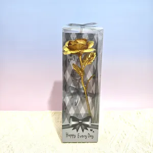 Single gold foil artificial rose flower gift in clear box with bow for Valentine's Day.