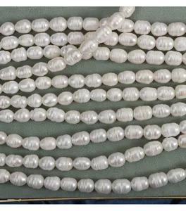 Detail of 9mm deep grooved freshwater pearl strands with large 2.5mm hole for jewelry.