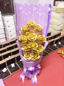 Gold foil artificial rose bouquet for Valentine's Day gift, elegant purple gift wrapping.