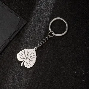 Stainless steel leaf keychain detail shot, showing the delicate leaf pendant and metal chain.