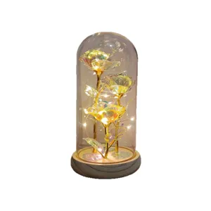Glass dome rose night light with three gold foil flowers and warm LED string lights for gifts.