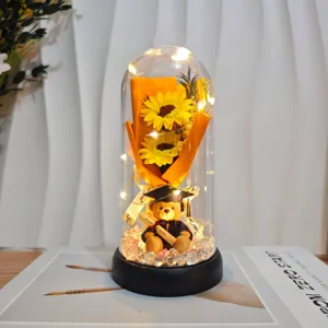 Graduation gift acrylic dome sunflower figurine with cute bear LED night light for students.