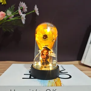 Graduation gift sunflower eternal flower LED night light with graduate doll figurine detail.