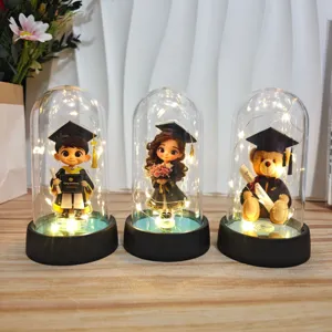Graduation acrylic dome night light with cute cartoon graduate student and bear figurines for gift.