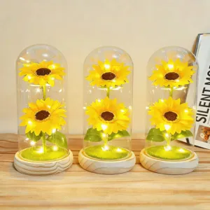 Sunflower glass dome night light with wooden base and LED lights, perfect decor gift.