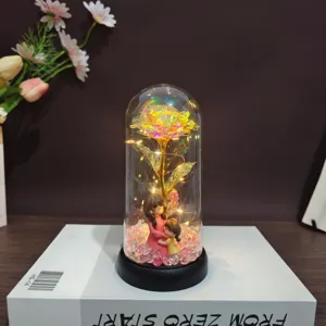 Gold foil rose glass dome gift with mother child figurine and LED lights for home decor.