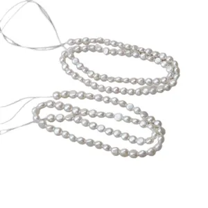 Natural white flat coin pearl loose beads for DIY jewelry making and crafting projects.