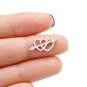 Close up view of stainless steel heart arrow DIY pendant charm detail showcasing cutout design.