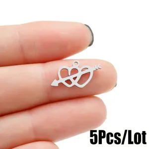 Stainless steel arrow through heart DIY pendant detail shot, high quality metal charm accessory.