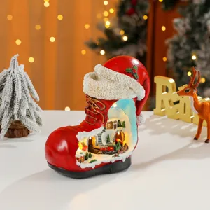 Christmas resin boot music box with winter landscape, glowing tabletop holiday decor gift.