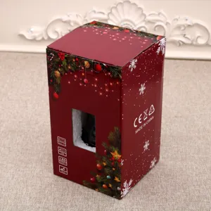Dettaglio confezione regalo di Natale con elementi festivi, caratteristiche del prodotto e finestra.