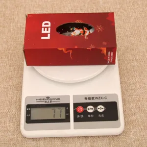 Christmas LED lantern night light desktop decoration with festive Santa Claus pattern box.