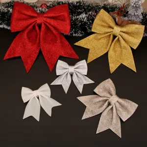 Close-up of glittery Christmas bows in various colors and sizes for festive holiday decor.