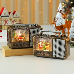 Christmas vintage radio snow globe detail, glowing music box decoration for holiday gift.