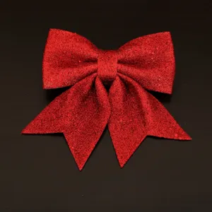 Red glitter Christmas bow ornament, perfect for holiday tree decoration and home festive setup.