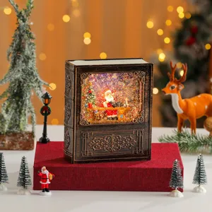 Christmas book water snow globe music box detailed view with glitter Santa scene desktop decor gift.