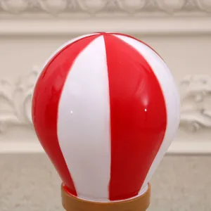 Red and white hot air balloon Christmas snow globe music box desktop home decor ornament.