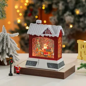 Christmas snow globe lantern with music and swirling glitter, festive red house tabletop decor.