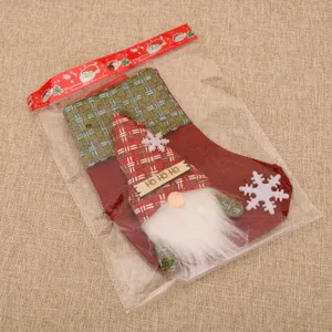 Calza di Natale in juta sacchetto regalo festoso con simpatico gnomo e targhetta.
