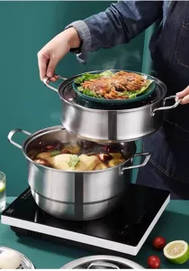 Stainless steel double layer steamer pot for cooking soup and steaming food in kitchen detail view