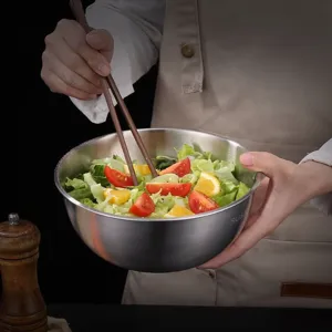 Stainless steel salad bowl with food prep, durable kitchen mixing bowl for home cooking and baking.