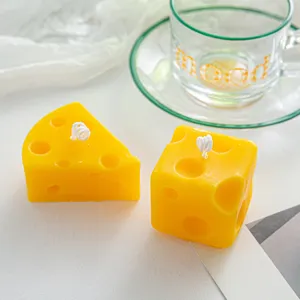 Creative cheese scented candles detail view, cute cube and wedge wax for home decor.