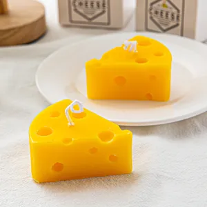 Cute cheese shaped scented candle creative home decor photography prop and unique gift option.