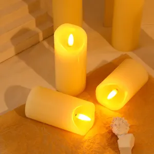 Primo piano di candele LED con luce gialla calda per decorazioni di feste e matrimoni.