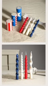 Detail view of patriotic red white and blue scented pillar and twisted candles with star prints.