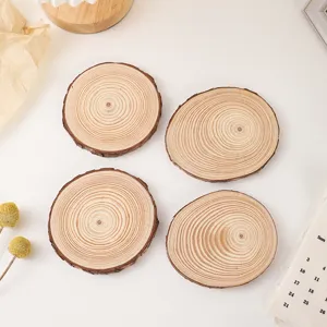 Natural wood slice coasters rustic log tree bark candle holder home table decor flat lay