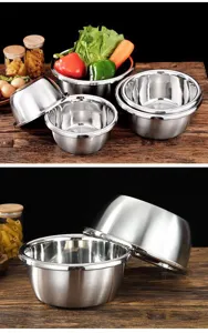 Stainless steel mixing bowl detail showing nested design, durable thick material for cooking.