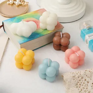 Cute bubble and cloud scented candles in various colors, perfect home decor and photography props.