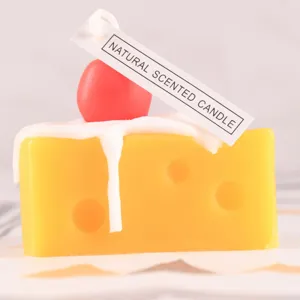 Detailed close-up shot showing the cheese scented candle featuring cream and cherry decoration.