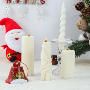 Detailed view of white geometric scented candles perfect for Christmas holiday decor and gifts.
