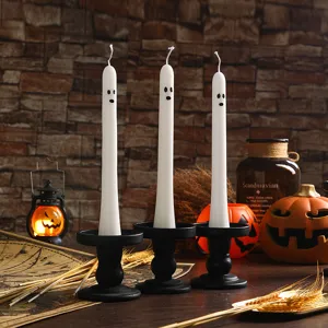 Halloween ghost taper candles for spooky party decor, premium white wax atmospheric home props.