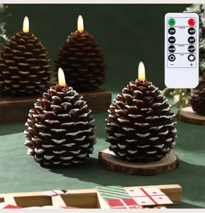 Detailed view of Christmas pine cone LED paraffin candle set with multi-function remote control.