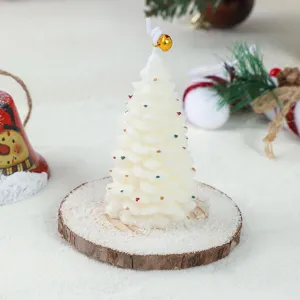 Christmas tree scented candle, geometric wax ornament with wooden base for holiday party decor.