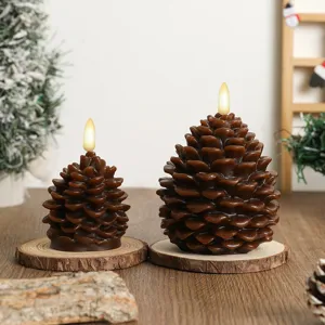 Detail shot of Christmas pinecone LED candles on wood slices, cozy festive atmosphere decor.