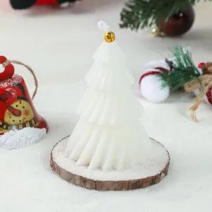 Christmas tree scented candle detail view, geometric wax decor for holiday party gift setup.