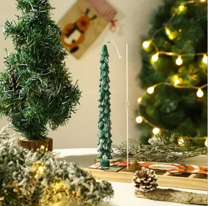 Christmas tree shaped scented candle, green frosted design with festive holiday atmosphere decor.